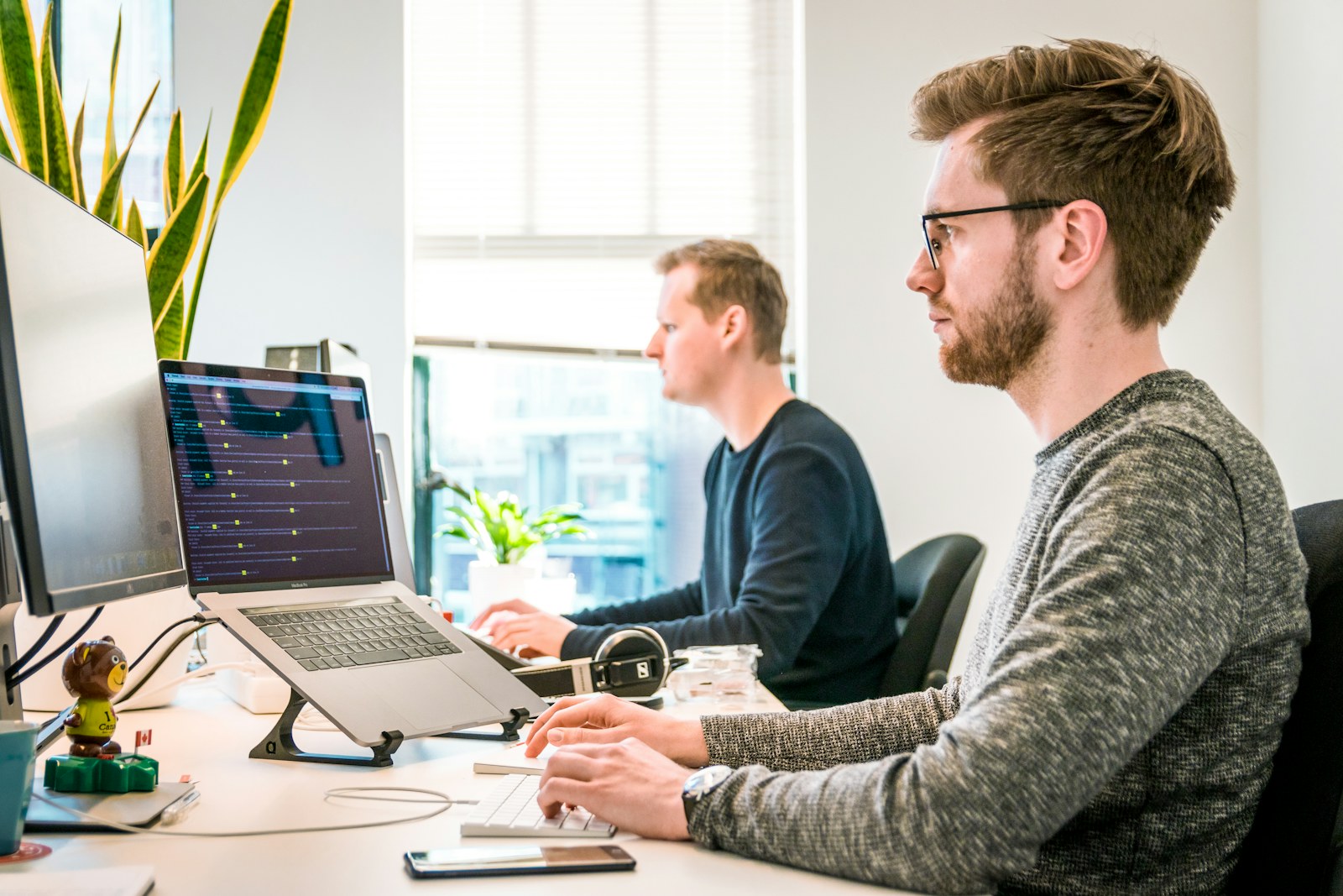 Colleagues reviewing work together at a desk